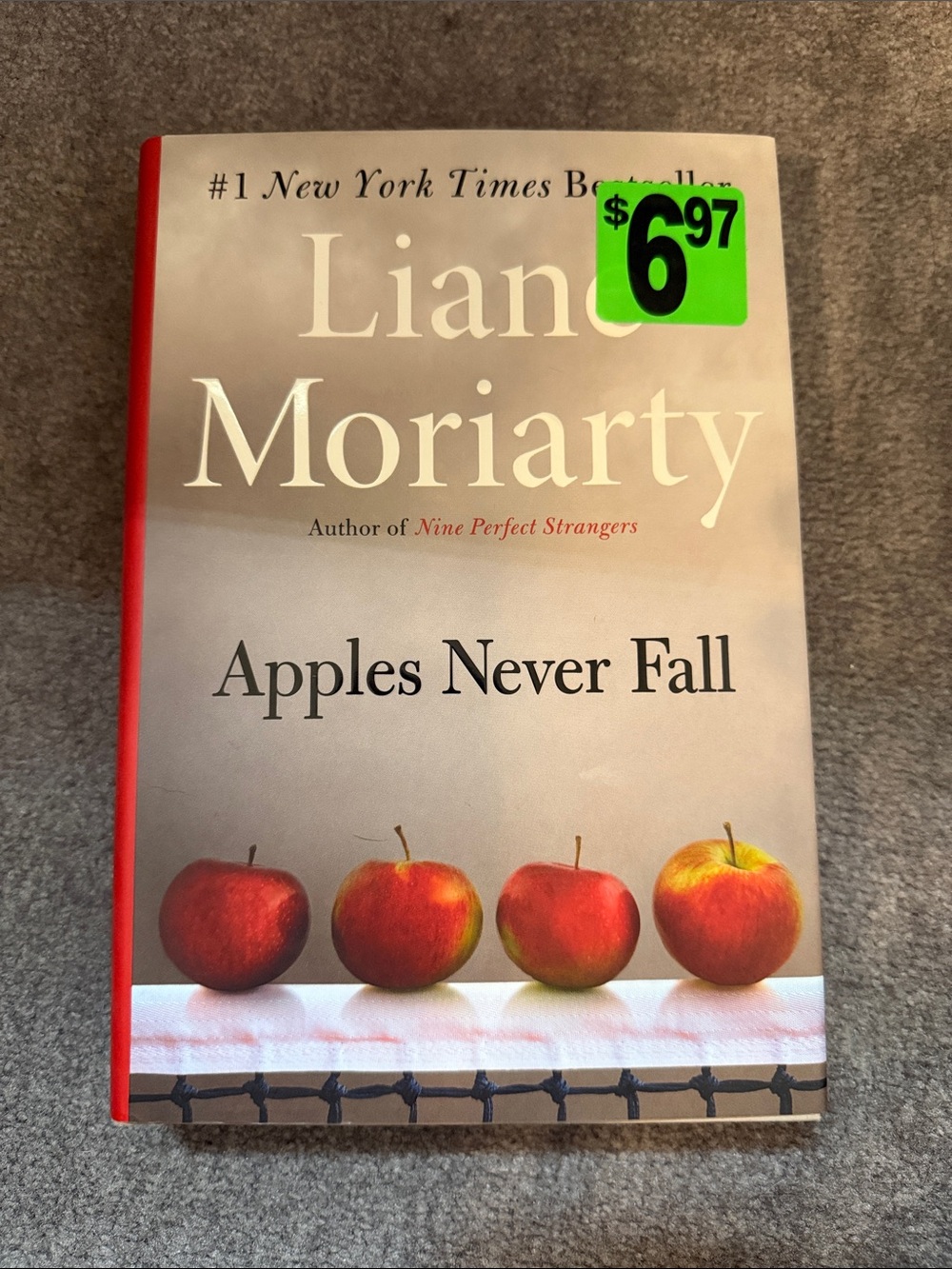 Liane Moriarty "Apples Never Fall" Hardcover - Red Accents